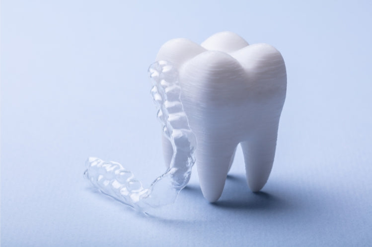 Night guard with teeth