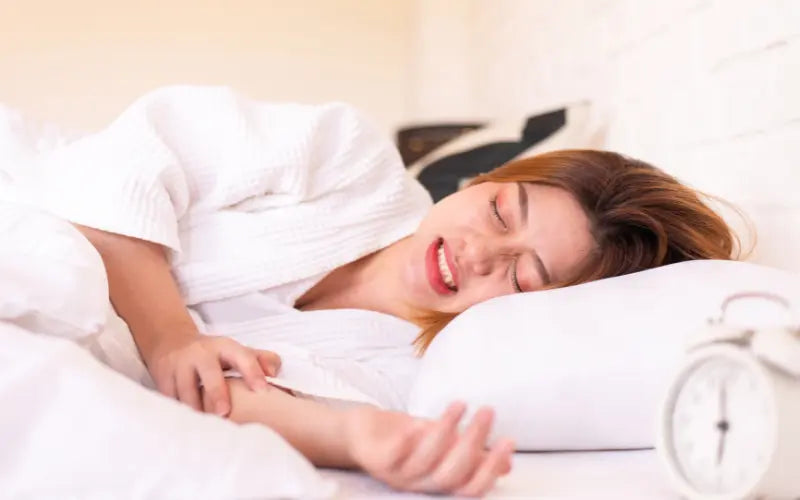 A girl grinding her teeth while sleeping